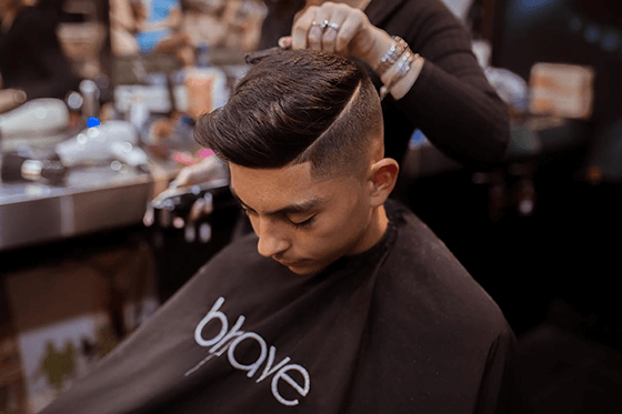 Young man getting haircut